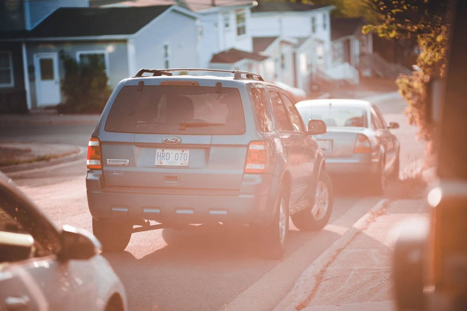 Cars parked along a curb on a city street, illustrative of the kind of street parking listed on ParkSpotter